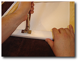 16 x 20 Canvas Stretching - Step 25 - Wrap canvas on opposite side and grip with canvas pliers